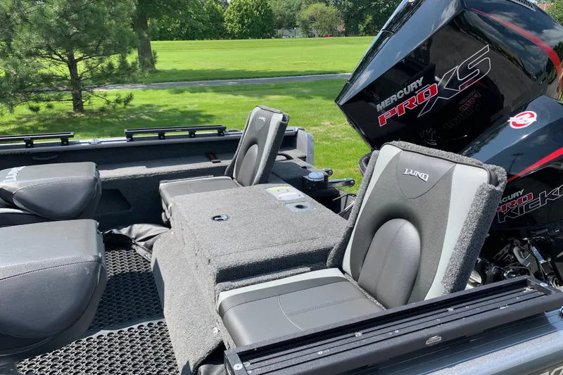 Slide: The Image of 2025 Lund 2075 Impact XS boat interior with Mercury Pro XS engine, featuring comfortable seating. - 15