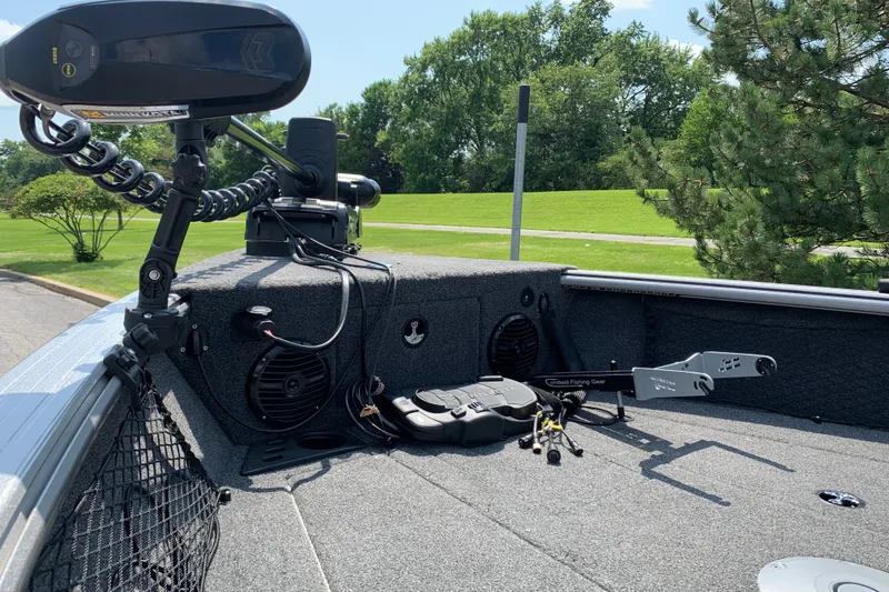 Slide: The Image of 2025 Lund 2075 Impact XS boat deck with fishing gear and trolling motor. - 23