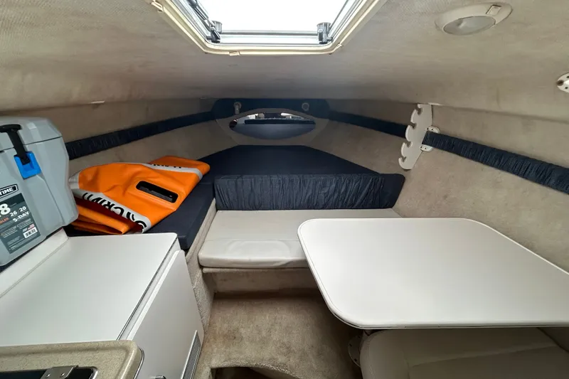 Slide: The Image of Interior cabin of 2002 Wellcraft 2600 Martinique boat with seating and storage. - 4