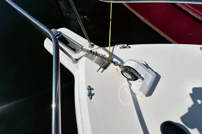 Slide: The Image of Bow of 2002 Wellcraft 2600 Martinique with anchor chain and winch system. - 13