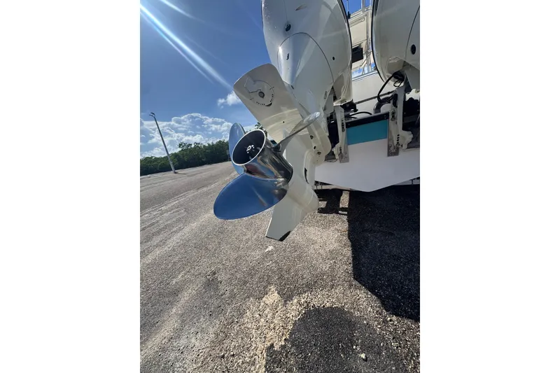 Slide: The Image of Propeller of a 2003 Contender 25 Open boat under clear blue sky. - 31