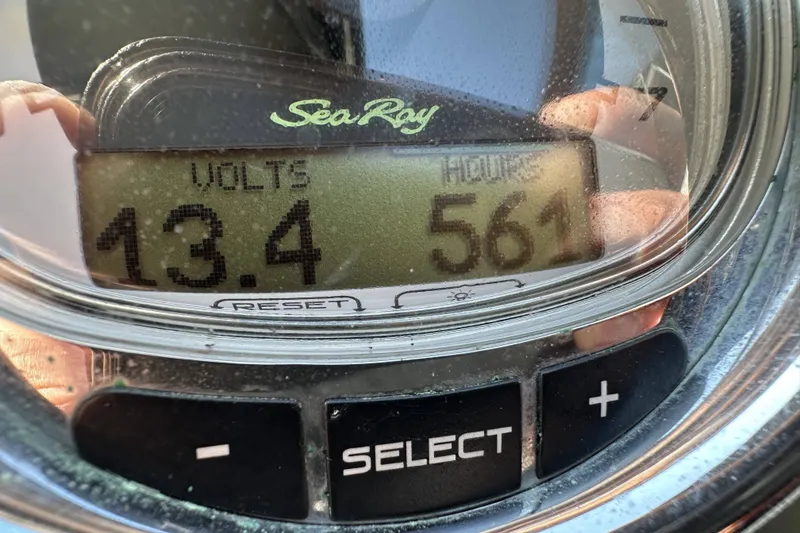 Slide: The Image of Close-up of Sea Ray SLX 250 gauge showing 13.4 volts and 561 hours. - 8
