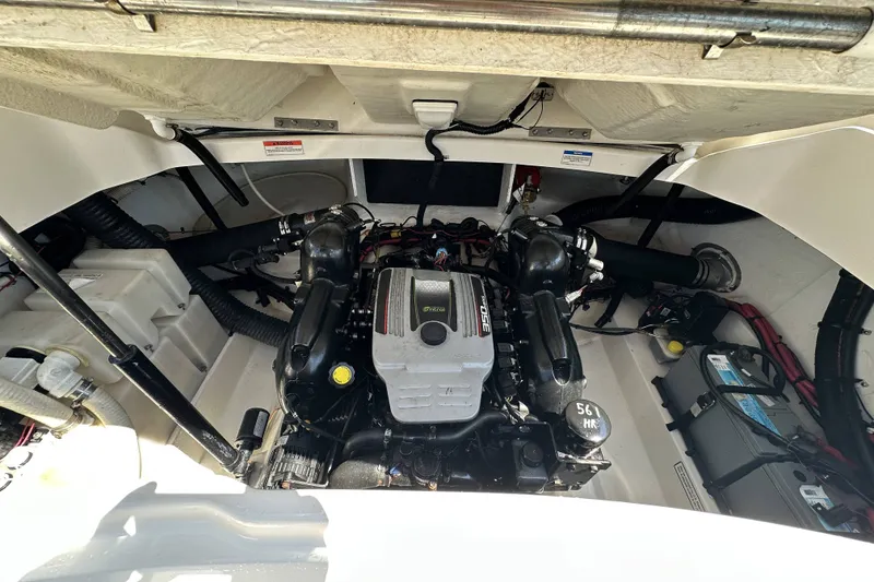 Slide: The Image of Engine compartment of a 2012 Sea Ray SLX 250 boat, showcasing the engine and components. - 6