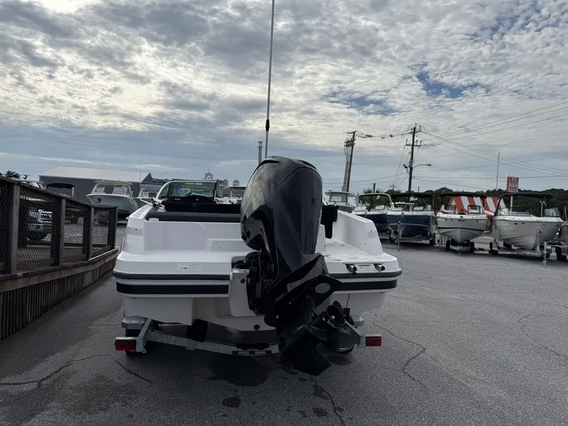 Slide: The Image of The image shows a 2019 Four Winns HD 200 Freedom boat on a trailer. The outboard motor is visible. - 6