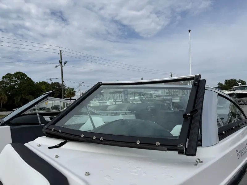 Slide: The Image of A 2019 Four Winns HD 200 Freedom with sleek design and clear lines, parked outdoors. - 27