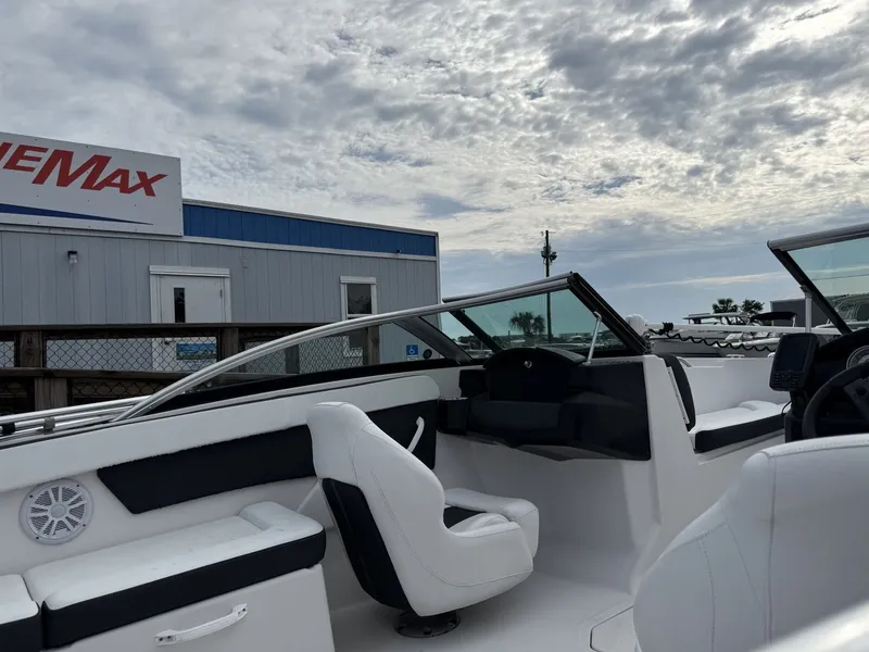 Slide: The Image of The image shows a modern motorboat with white seating and a black dashboard. - 15