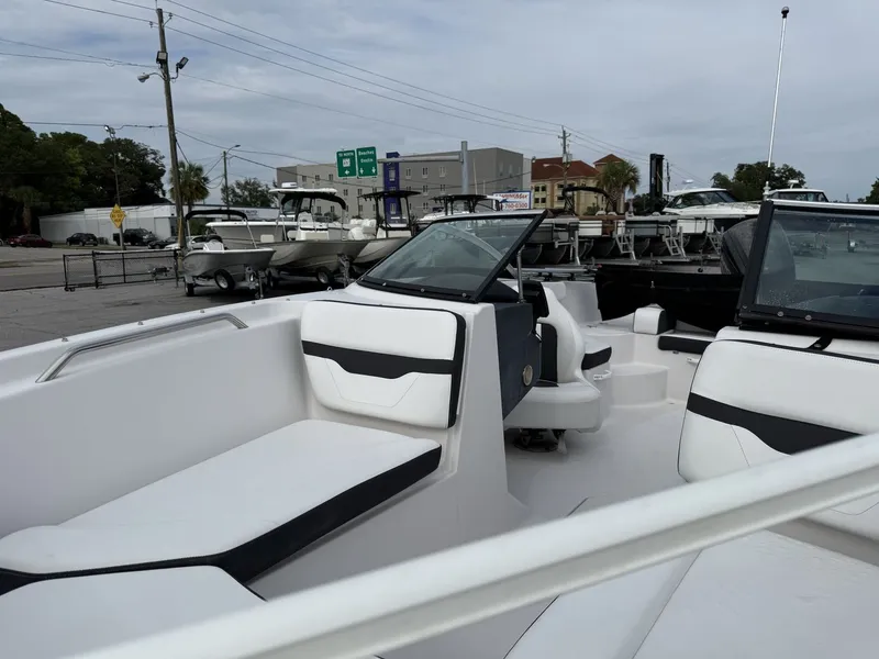 Slide: The Image of The image shows the cockpit of a 2019 Four Winns HD 200 Freedom boat. - 24
