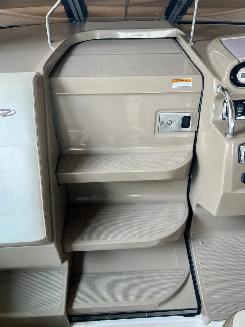 Slide: The Image of The interior steps of the 2017 Regal 26 Express lead to the cabin. - 14