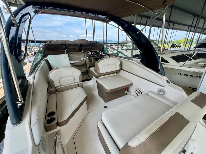 Slide: The Image of The image shows the cockpit of a 2017 Regal 26 Express boat with beige upholstery. - 5