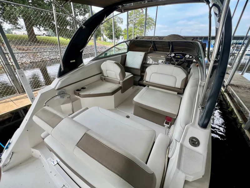 Slide: The Image of The image shows the cockpit of a 2017 Regal 26 Express with beige upholstery and a helm station. - 6
