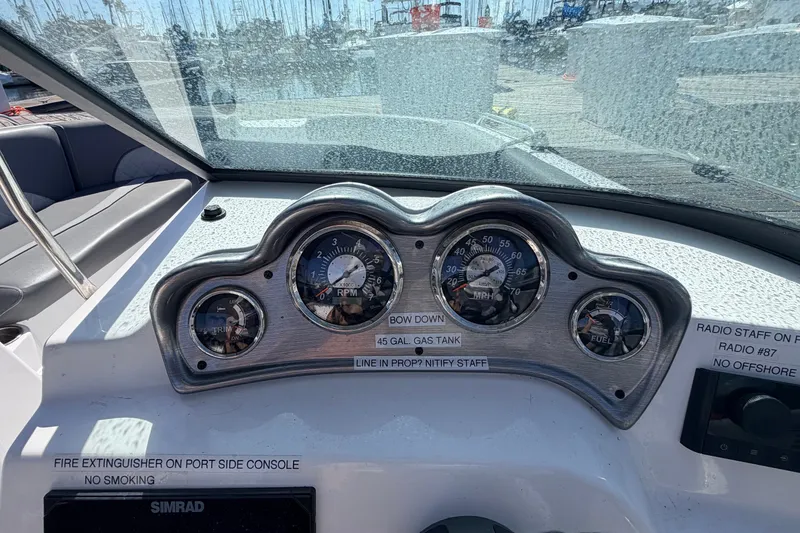 Slide: The Image of Dashboard of 2026 NauticStar 203 DC Deck boat with gauges and controls. - 15