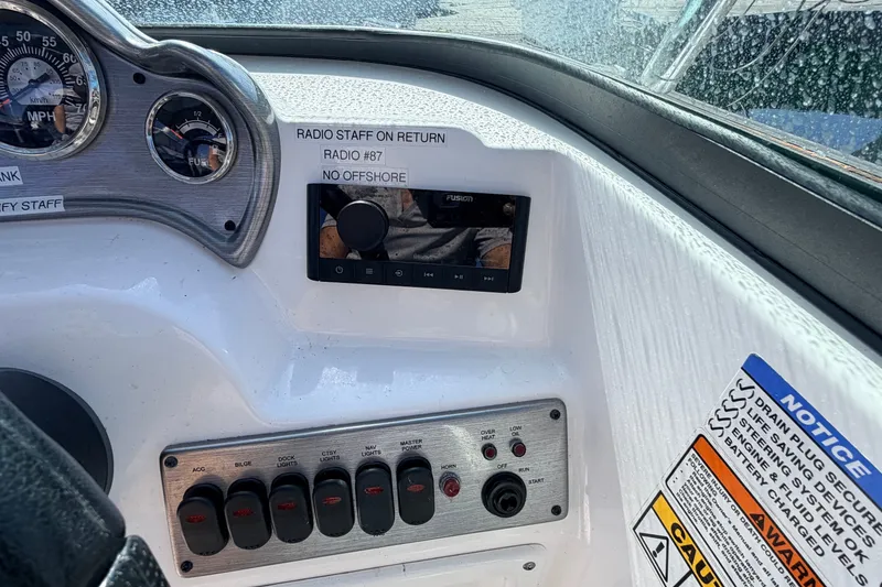 Slide: The Image of Dashboard of 2026 NauticStar 203 DC Deck boat with gauges and controls. - 14