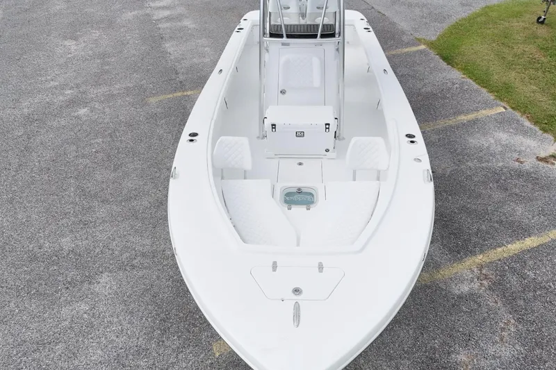 Slide: The Image of 2027 BlackJack 256 Coastal boat, top view, parked on pavement near grass. - 4