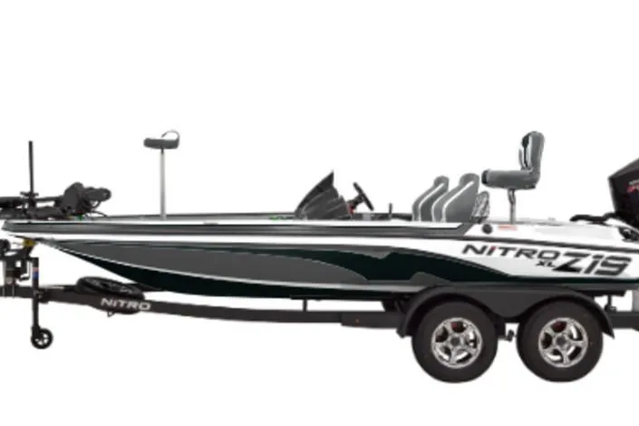 Slide: The Image of 2027 Nitro Z18 Pro fishing boat on trailer, sleek design, dual seats, modern features. - 2