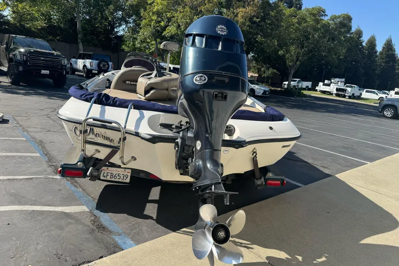 Slide: The Image of 2004 Ranger 185 VS boat with outboard motor in parking lot. - 5