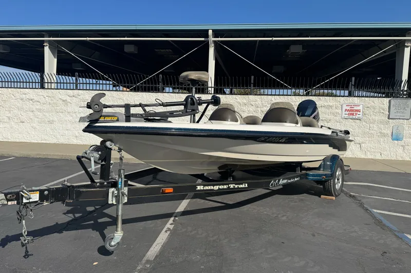 Slide: The Image of 2004 Ranger 185 VS boat on trailer in parking lot, sunny day. - 2