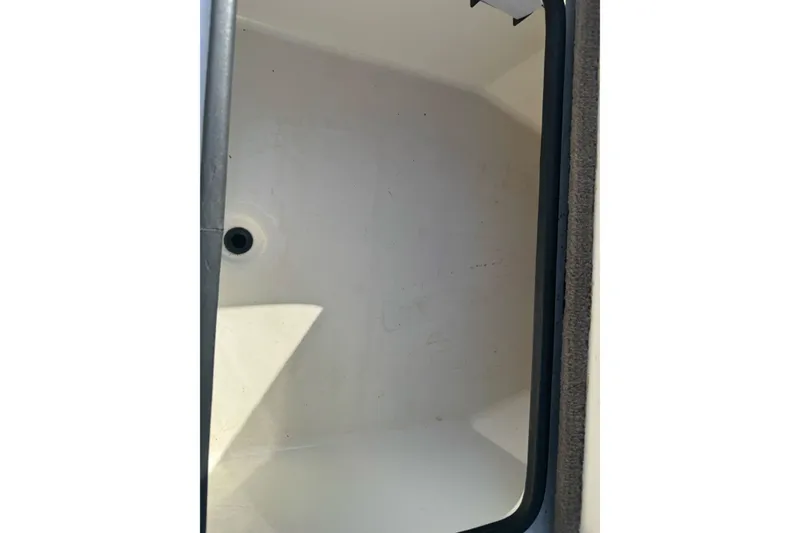 Slide: The Image of Empty storage compartment in a 2004 Ranger 185 VS boat. - 20