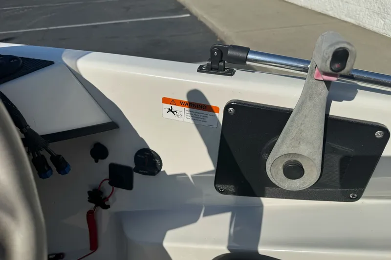 Slide: The Image of 2004 Ranger 185 VS boat interior with control panel and warning label. - 15