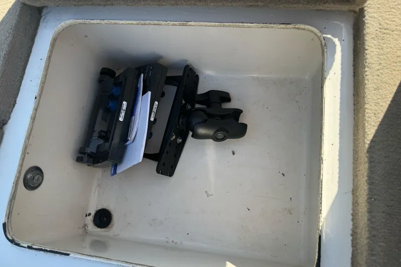 Slide: The Image of Storage compartment in a 2004 Ranger 185 VS boat with mounted equipment. - 24