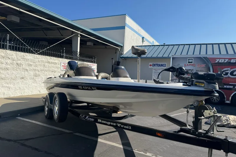Slide: The Image of 2004 Ranger 185 VS boat on trailer in parking lot, sunny day. - 3
