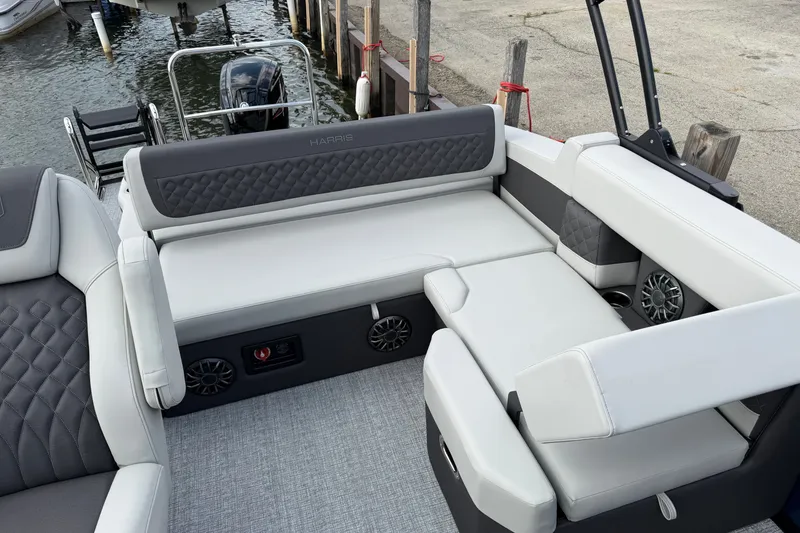 Slide: The Image of Luxurious seating on 2027 Harris Sunliner 210 pontoon boat at dockside. - 1