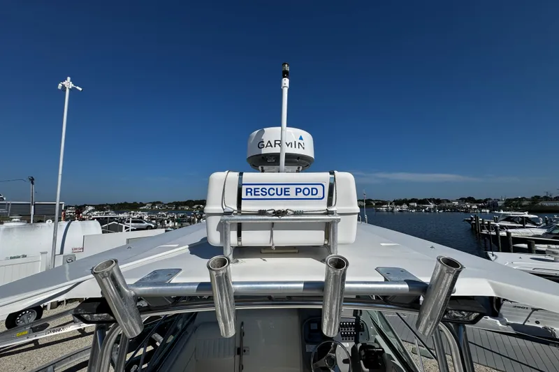 Slide: The Image of 2010 Robalo R265 Walkaround boat with Garmin radar and rescue pod at marina. - 8