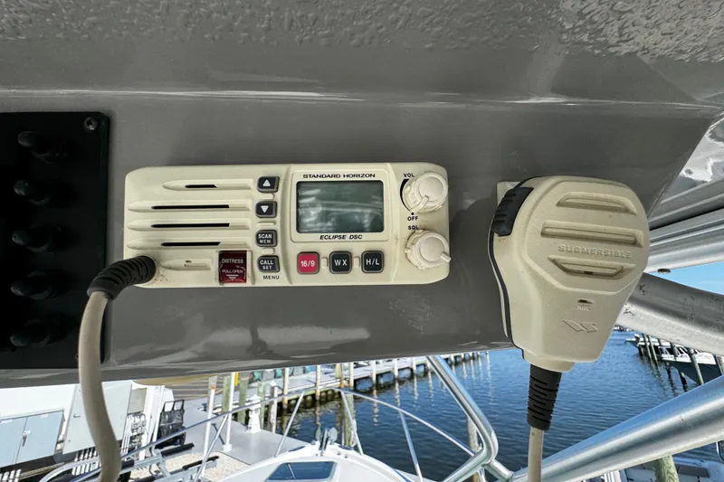 Slide: The Image of VHF radio system on 2010 Robalo R265 Walkaround boat, dockside view. - 34