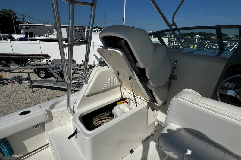 Slide: The Image of 2010 Robalo R265 Walkaround boat interior with open storage compartment. - 36