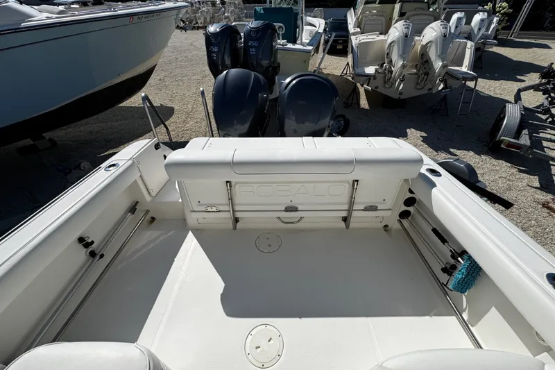 Slide: The Image of 2010 Robalo R265 Walkaround boat interior with dual outboard engines. - 12
