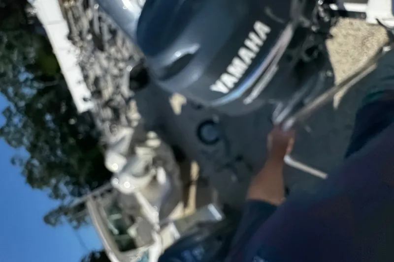 Slide: The Image of Blurry image of a Yamaha engine on a 2010 Robalo R265 Walkaround boat. - 7
