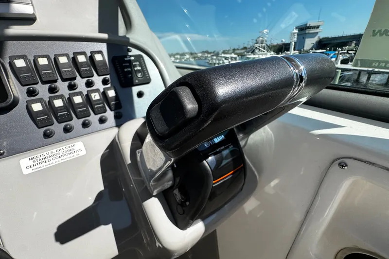 Slide: The Image of Control panel of a 2010 Robalo R265 Walkaround boat with Yamaha throttle. - 28