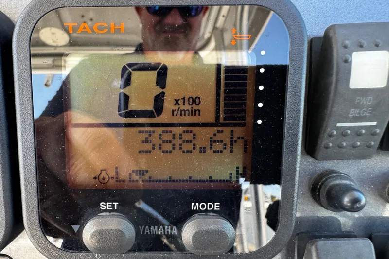 Slide: The Image of Tachometer display on 2010 Robalo R265 Walkaround showing 388.6 hours. - 45