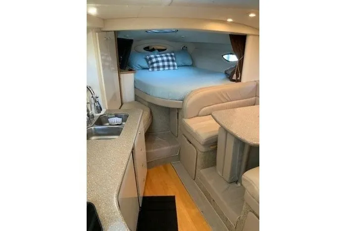Slide: The Image of Interior of 2000 Maxum 3200 SCR boat with cozy sleeping area and kitchenette. - 11
