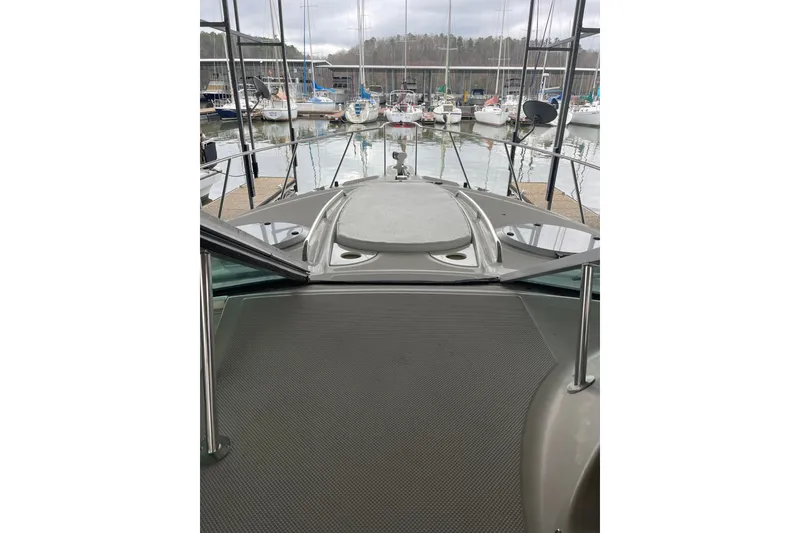 Slide: The Image of 2000 Maxum 3200 SCR yacht docked at marina with surrounding boats. - 5