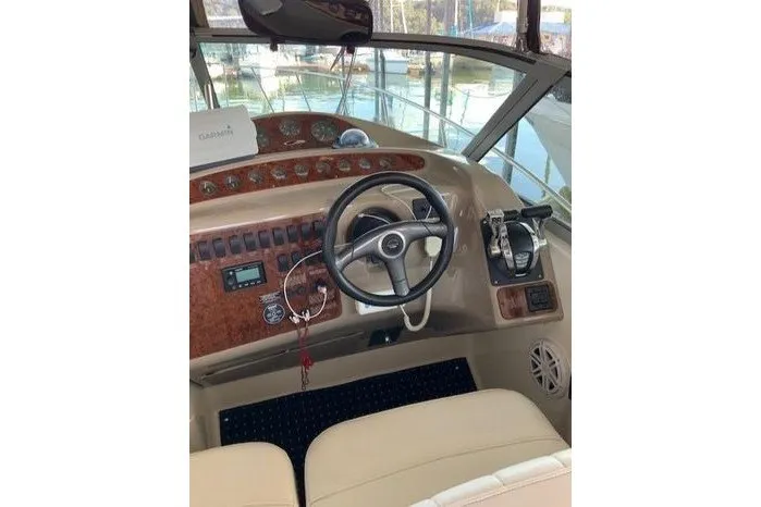 Slide: The Image of Helm of 2000 Maxum 3200 SCR boat with steering wheel and controls. - 7