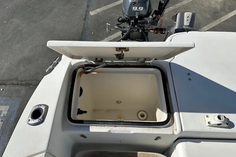 Slide: The Image of Open storage compartment on a 2005 Seaswirl Striper 2301 Walkaround I/O boat. - 27
