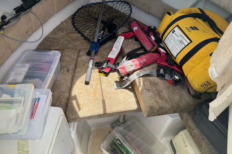 Slide: The Image of Interior of 2005 Seaswirl Striper 2301 with fishing gear and safety equipment. - 15