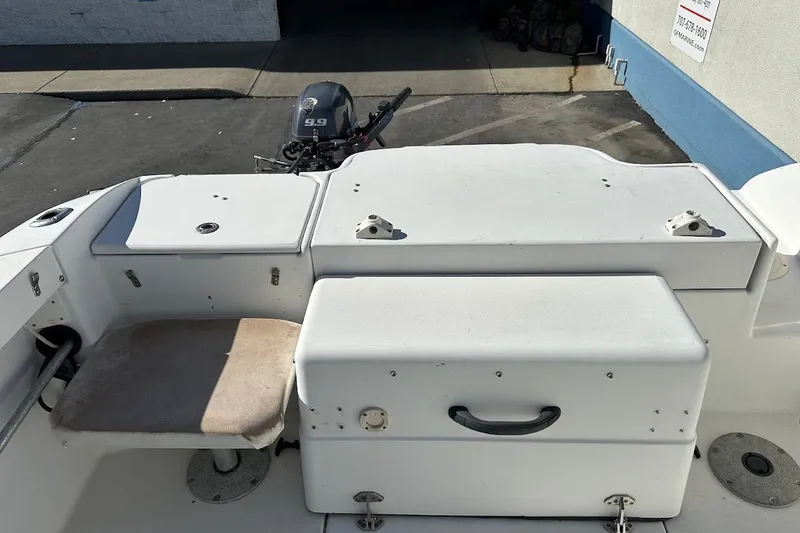 Slide: The Image of 2005 Seaswirl Striper 2301 Walkaround I/O boat interior with seating and storage compartments. - 26