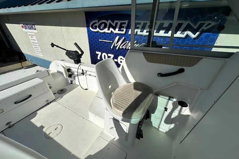 Slide: The Image of 2005 Seaswirl Striper 2301 Walkaround I/O boat interior with seating and fishing equipment. - 14