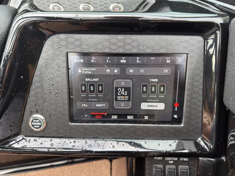 Slide: The Image of The image shows the dashboard of a MasterCraft NXT23 with a digital display for ballast control. - 37