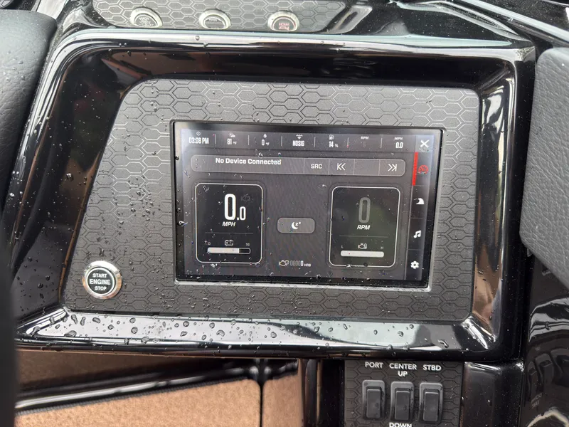 Slide: The Image of The dashboard of a MasterCraft NXT23 boat with a digital display and controls. - 44