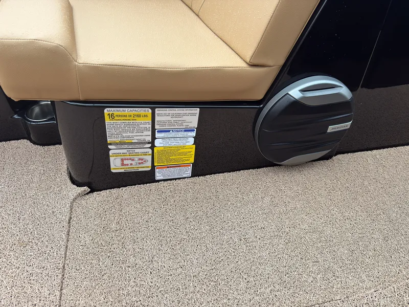 Slide: The Image of Close-up of a boat seat with safety and capacity labels on the side. - 46