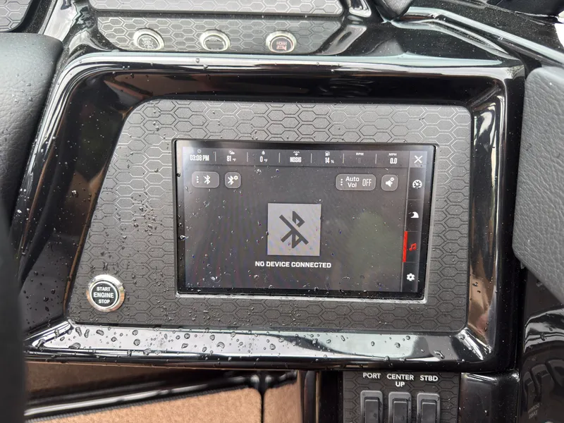 Slide: The Image of The dashboard of a MasterCraft NXT23 boat featuring a touchscreen display. - 45