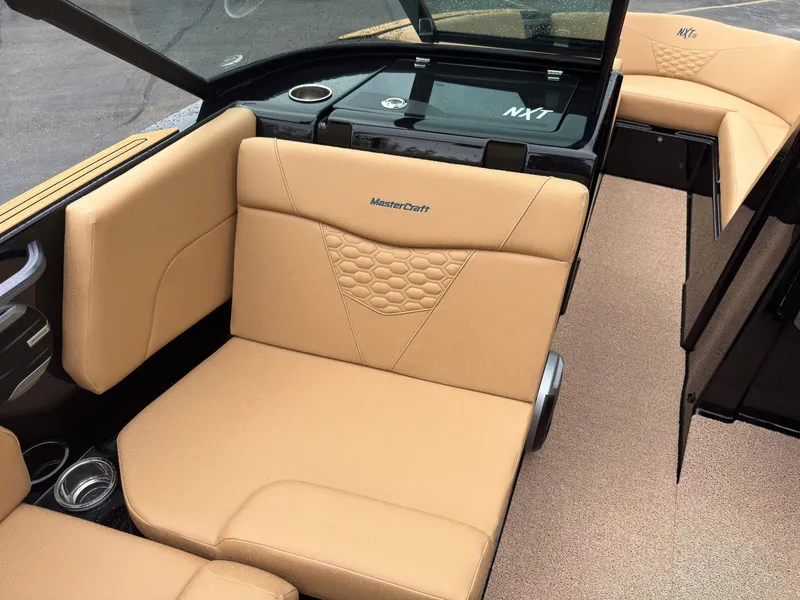 Slide: The Image of The image shows the interior of a 2027 MasterCraft NXT23 with beige upholstery and modern details. - 22