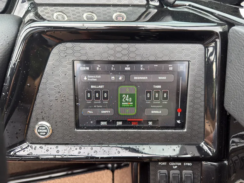 Slide: The Image of The image shows the dashboard of a MasterCraft NXT23 boat with a digital display. - 42