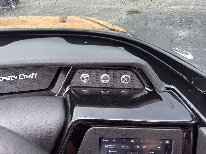 Slide: The Image of The dashboard of a MasterCraft NXT23 boat with modern controls and a display. - 35