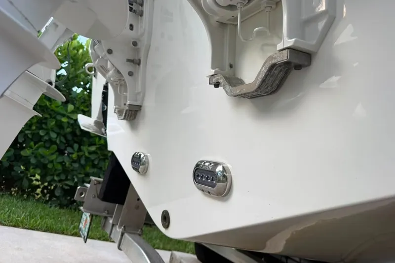Slide: The Image of 2024 Sea Hunt Gamefish 30CB boat stern with underwater lights and motor mounts. - 23