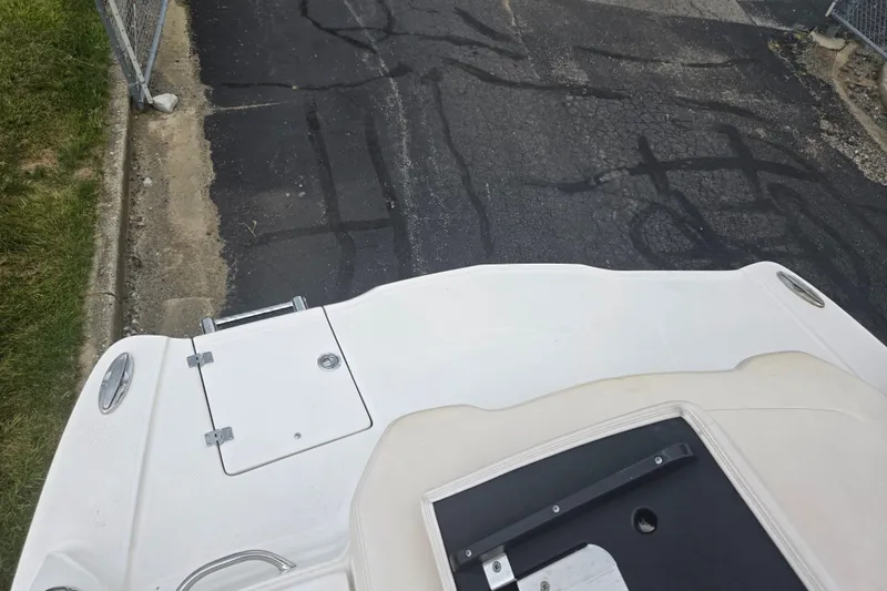 Slide: The Image of 2017 Chaparral 246 SSi boat stern view on asphalt surface. - 28