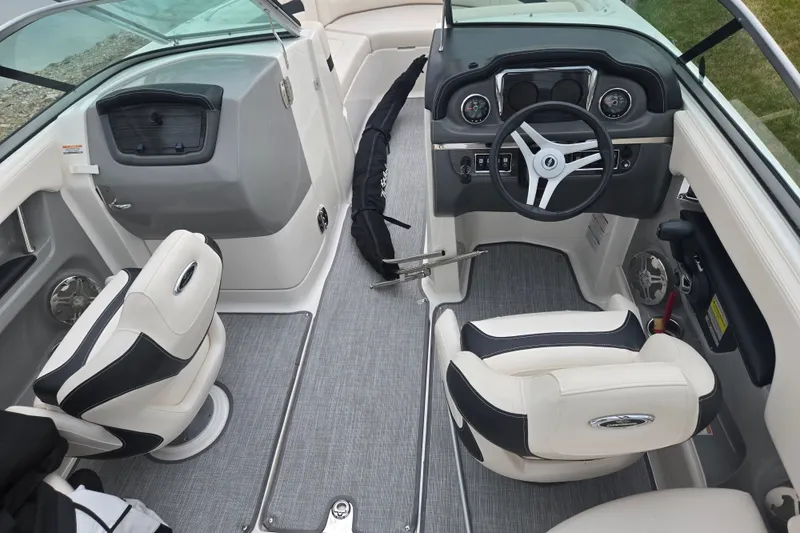 Slide: The Image of 2017 Chaparral 246 SSi boat interior with steering wheel and seating. - 11