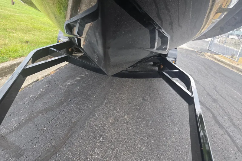 Slide: The Image of 2017 Chaparral 246 SSi boat on trailer, viewed from below, parked on asphalt. - 7